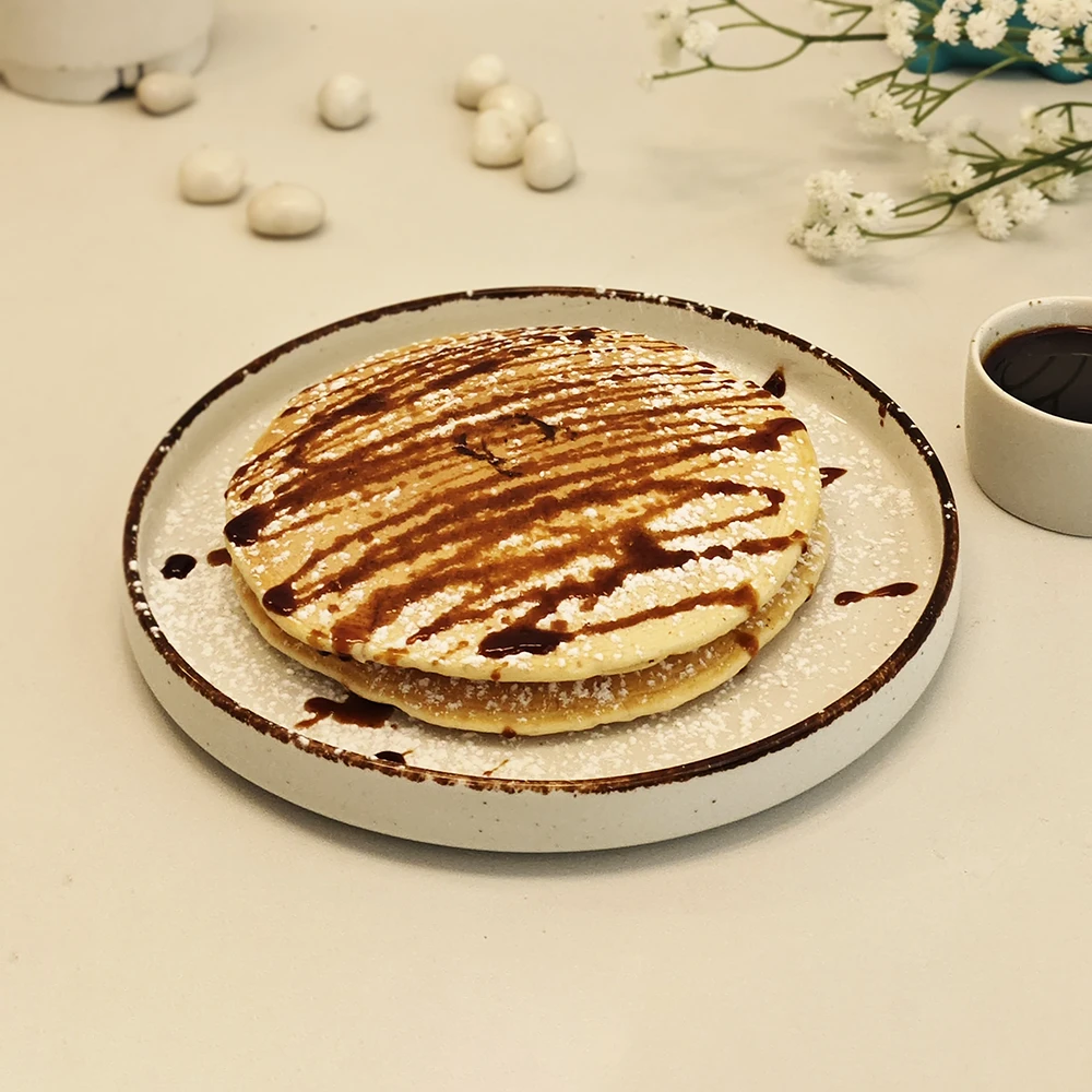 Classic Pancakes (Served with Maple Syrup & Chocolate Sauce, Topped with whipped cream)